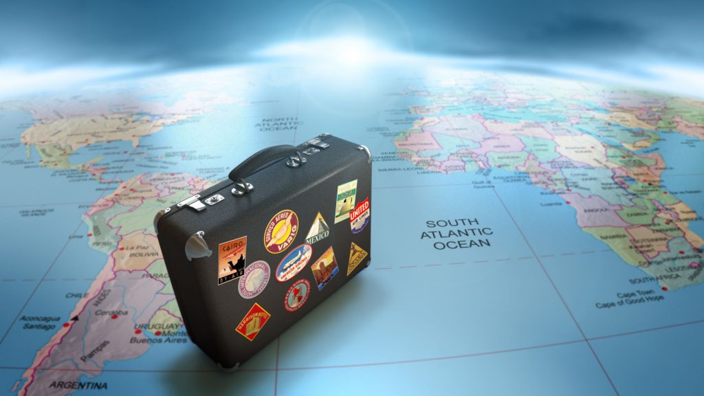 World map with travel bag, representing immigration.